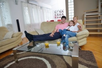 Happy young family in living room