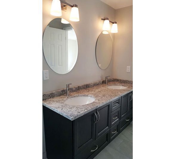 Double sink oak vanity with granite countertop