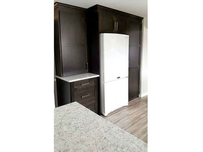 Kitchen pantry space with fridge insert