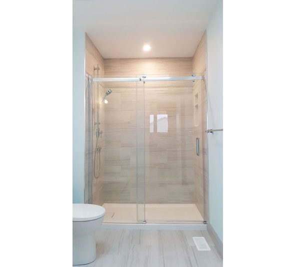 Alcove shower with glazed porcelain tile surround