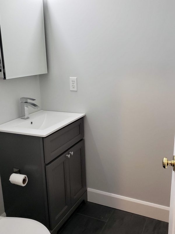 Powder room featuring single sink graphite paint vanity