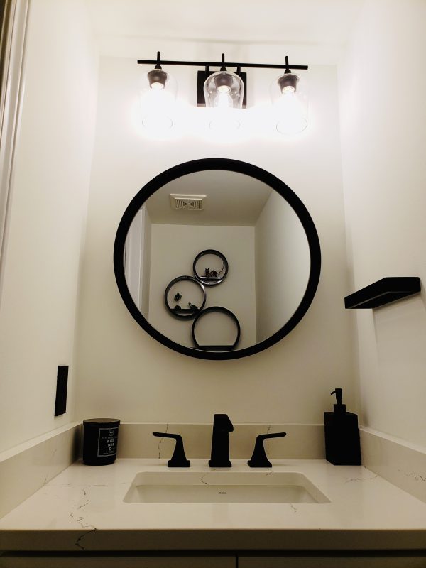 Matte black faucet and washroom accessories