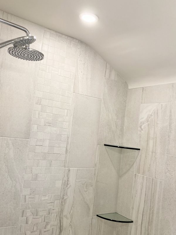 Pot light installed in ceiling above shower area
