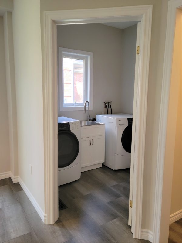 Laundry room renovated with new flooring, paint and laundry sink kit