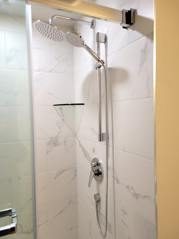 Wall tile installed with shower faucet system kit