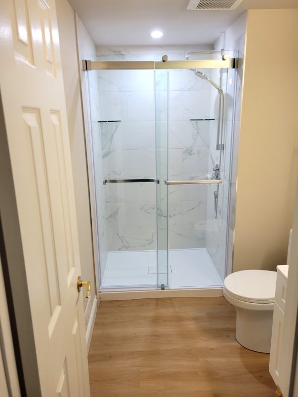 Shower base with sliding glass bypass doors
