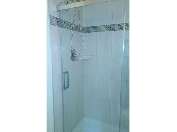 Tiled shower with glass doors