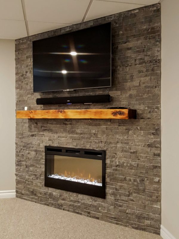 Electric fireplace with ledge stone surround