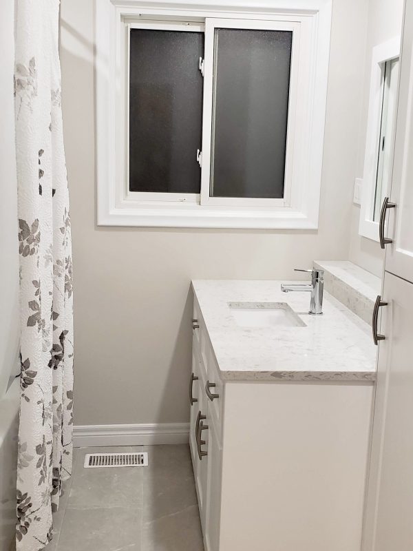 Bathroom renovation featuring quartz countertops