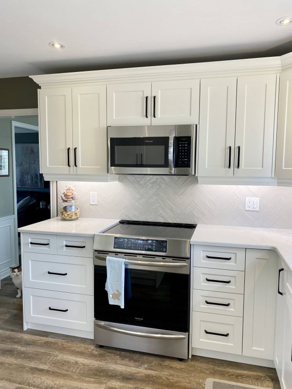 White cabinets with matte black handles