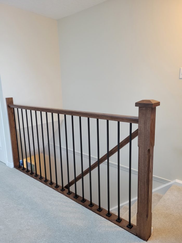 Handrail at top of stairs in loft area