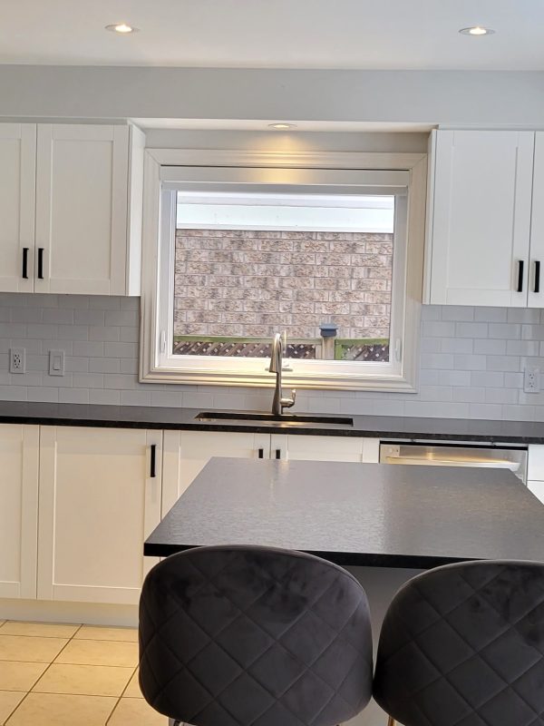 Kitchen reface featuring granite leathered countertop