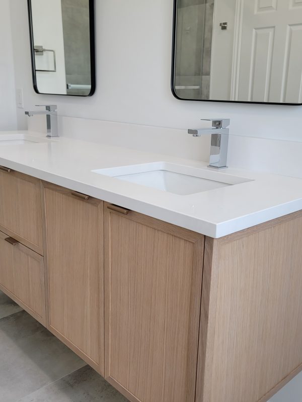 Undermount sinks and chrome square design faucets were installed
