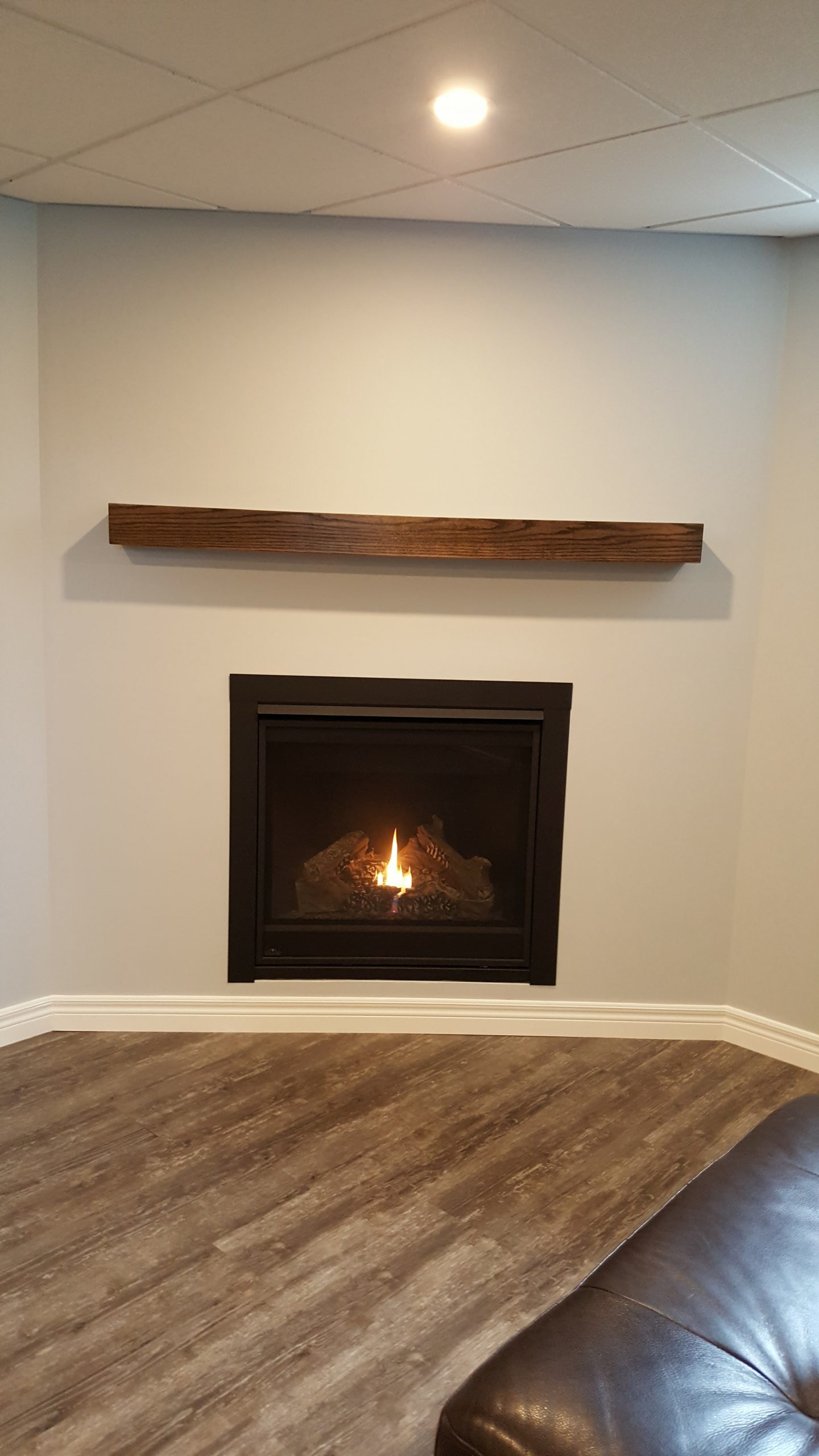 Modern fireplace surround with oak mantel