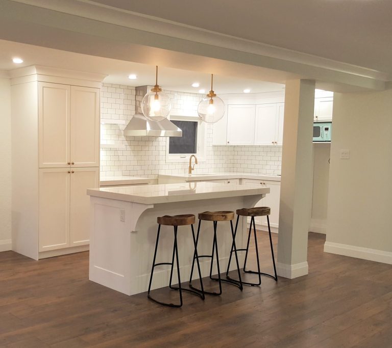 Upgraded kitchen featuring white quartz countertops