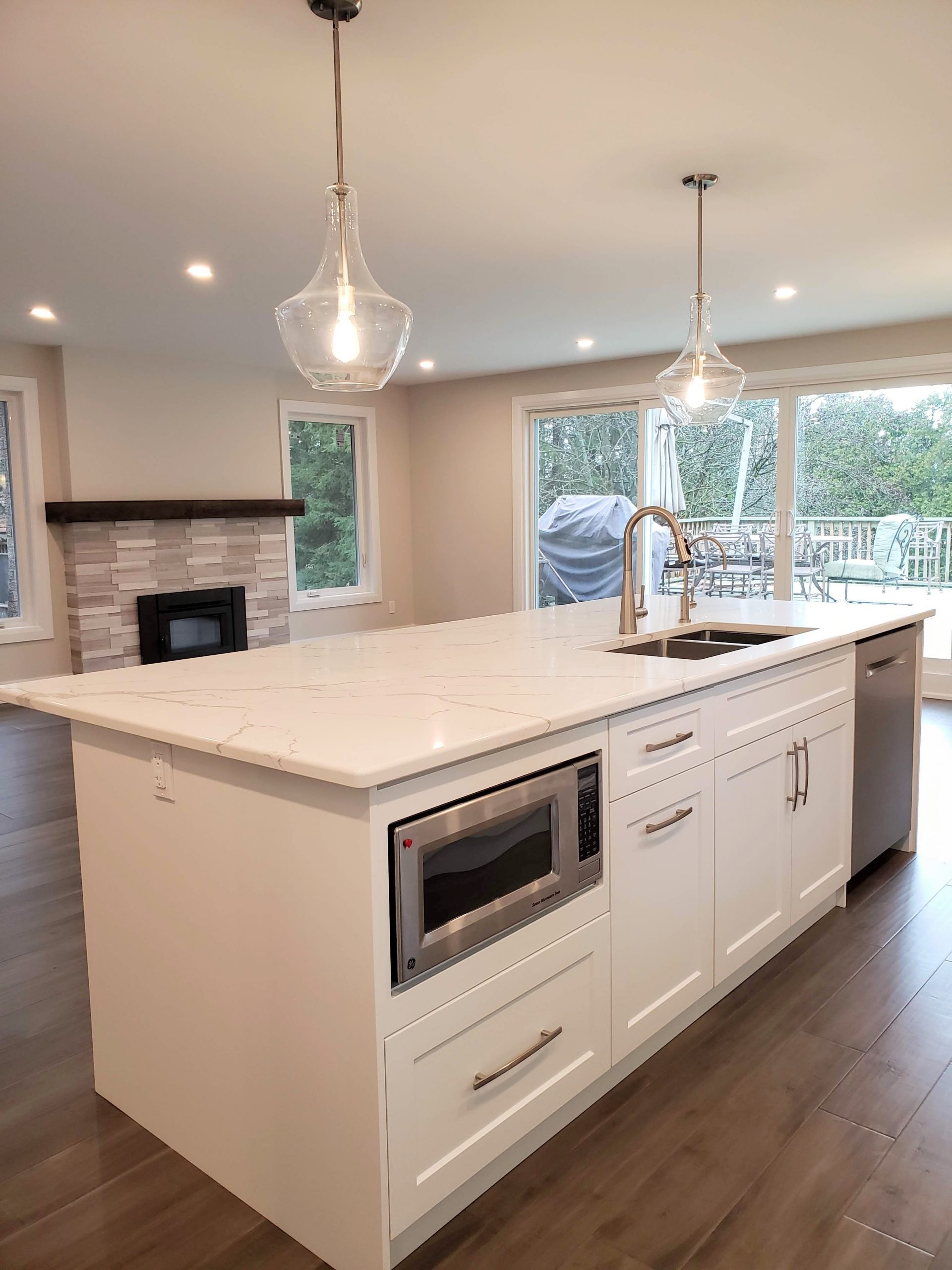 Kitchen island featuring quartz countertops