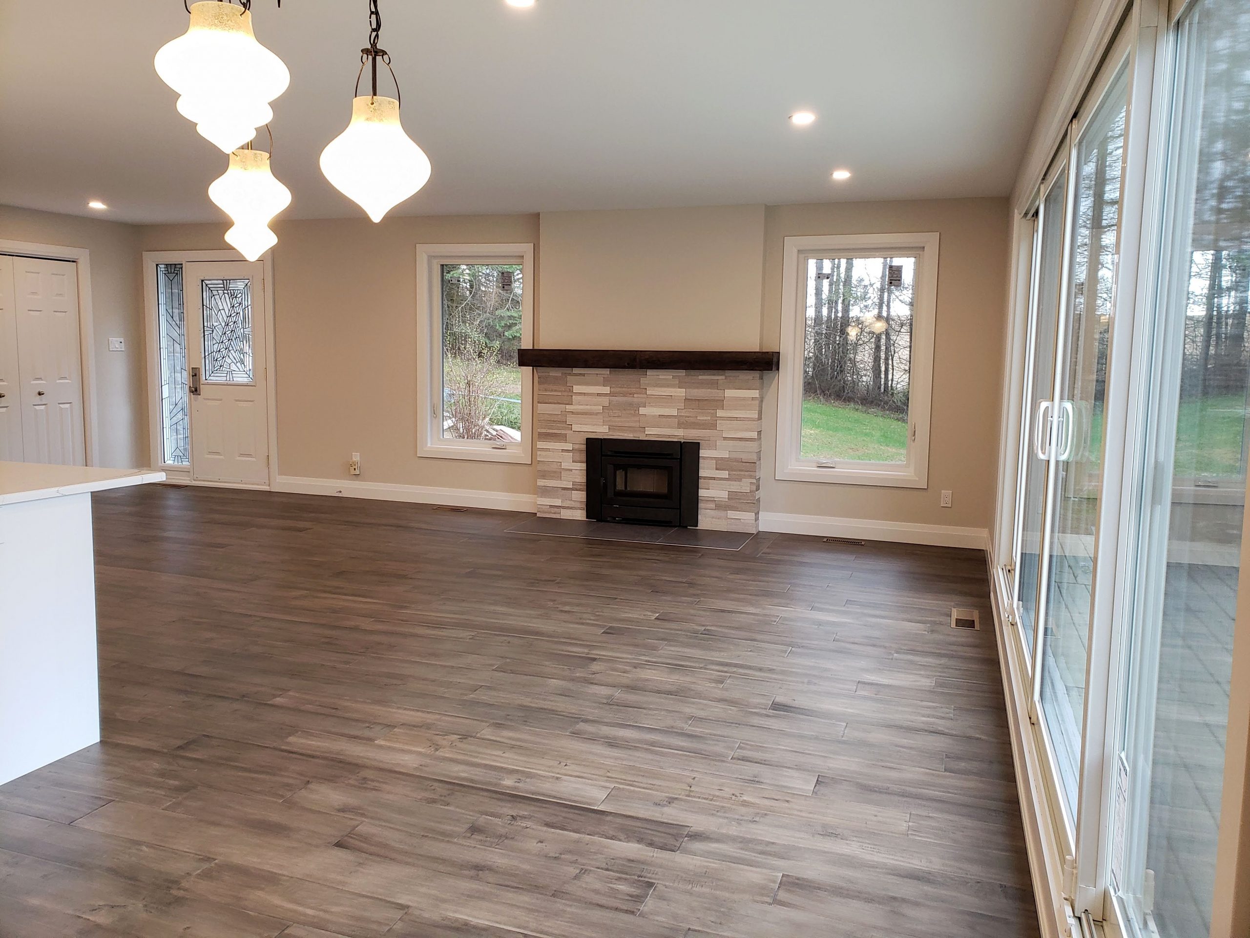 Open concept living room, with updated windows