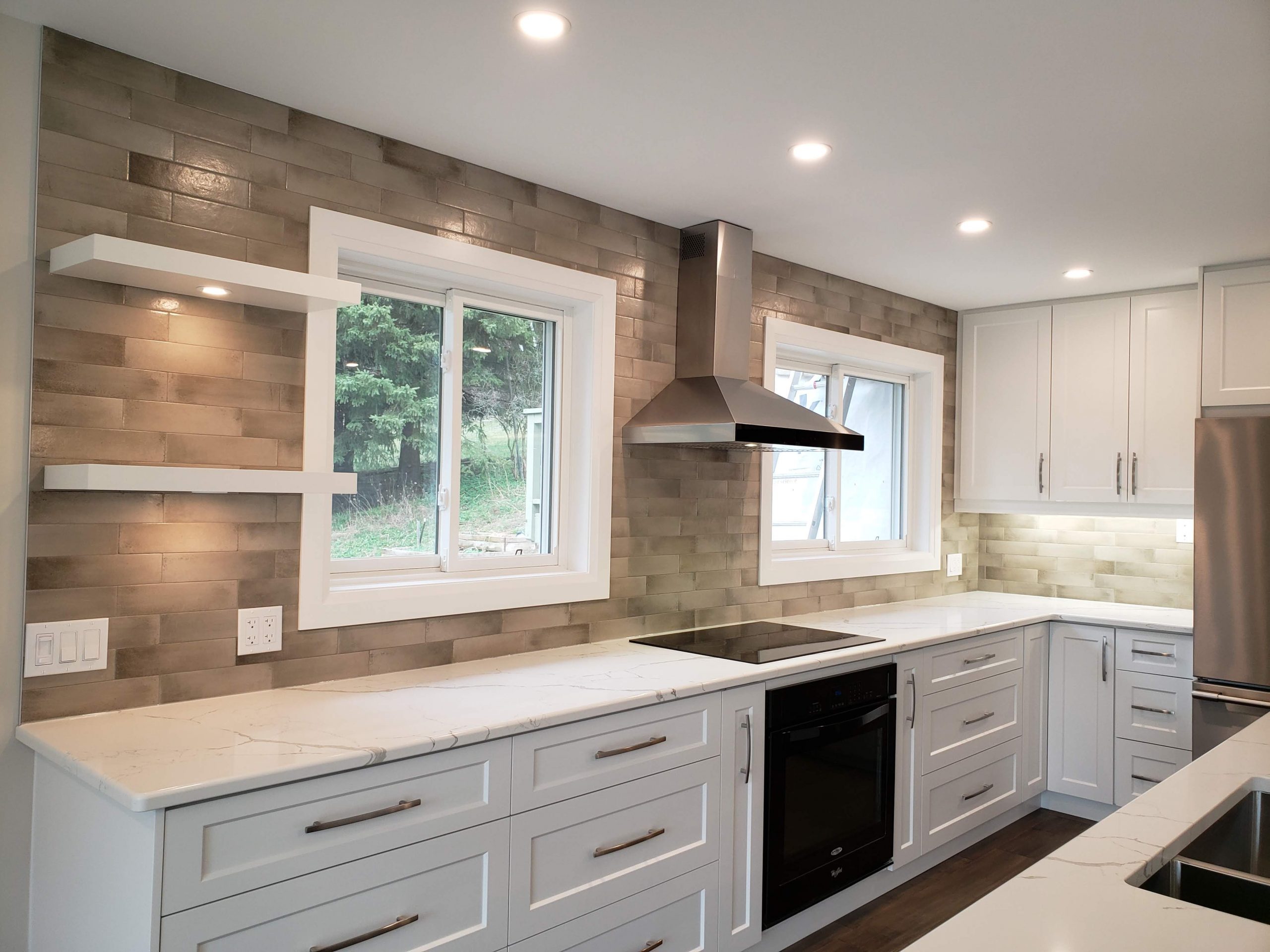 Quartz backsplash featuring floating shelves