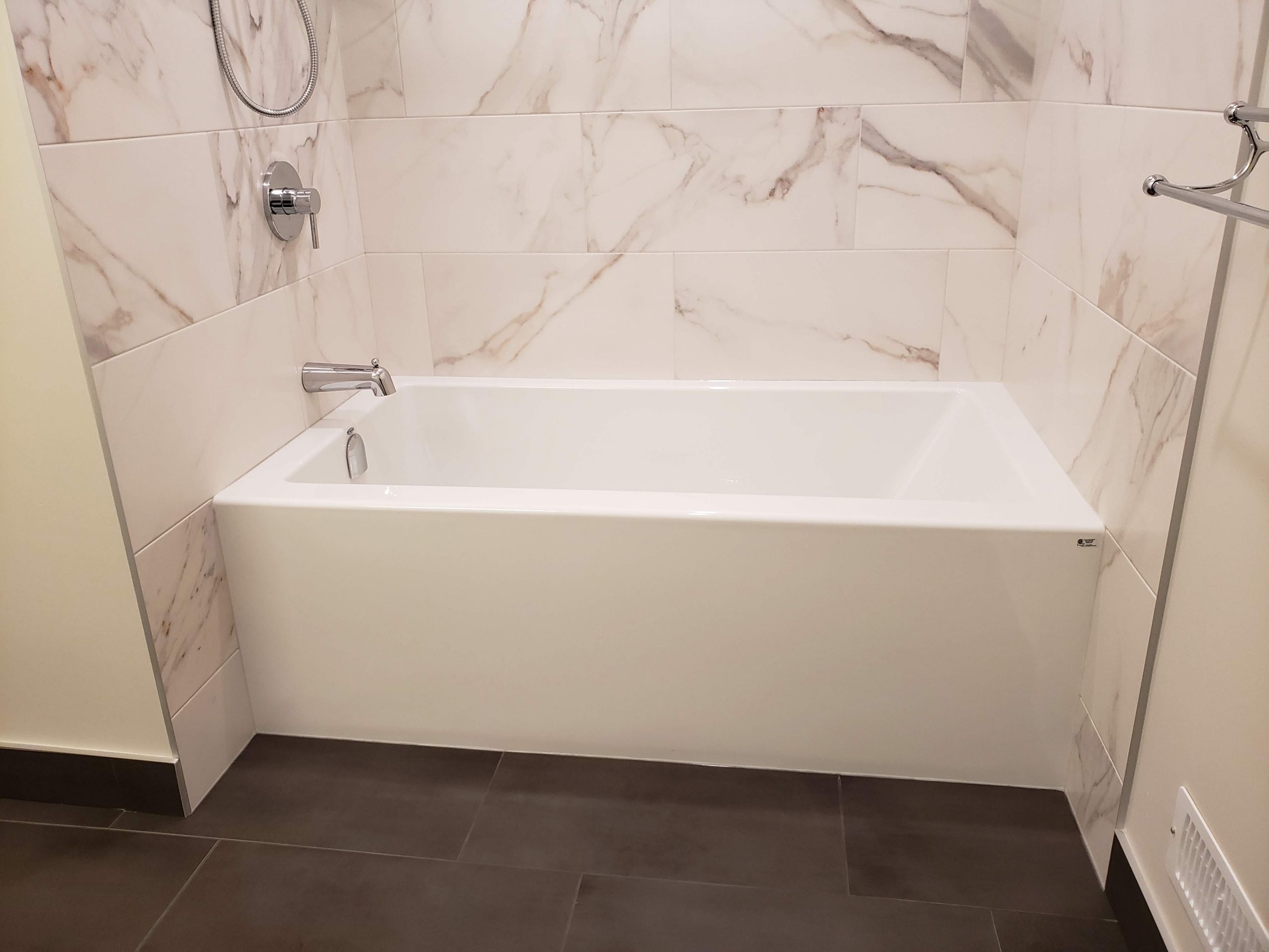 Three wall alcove bathtub