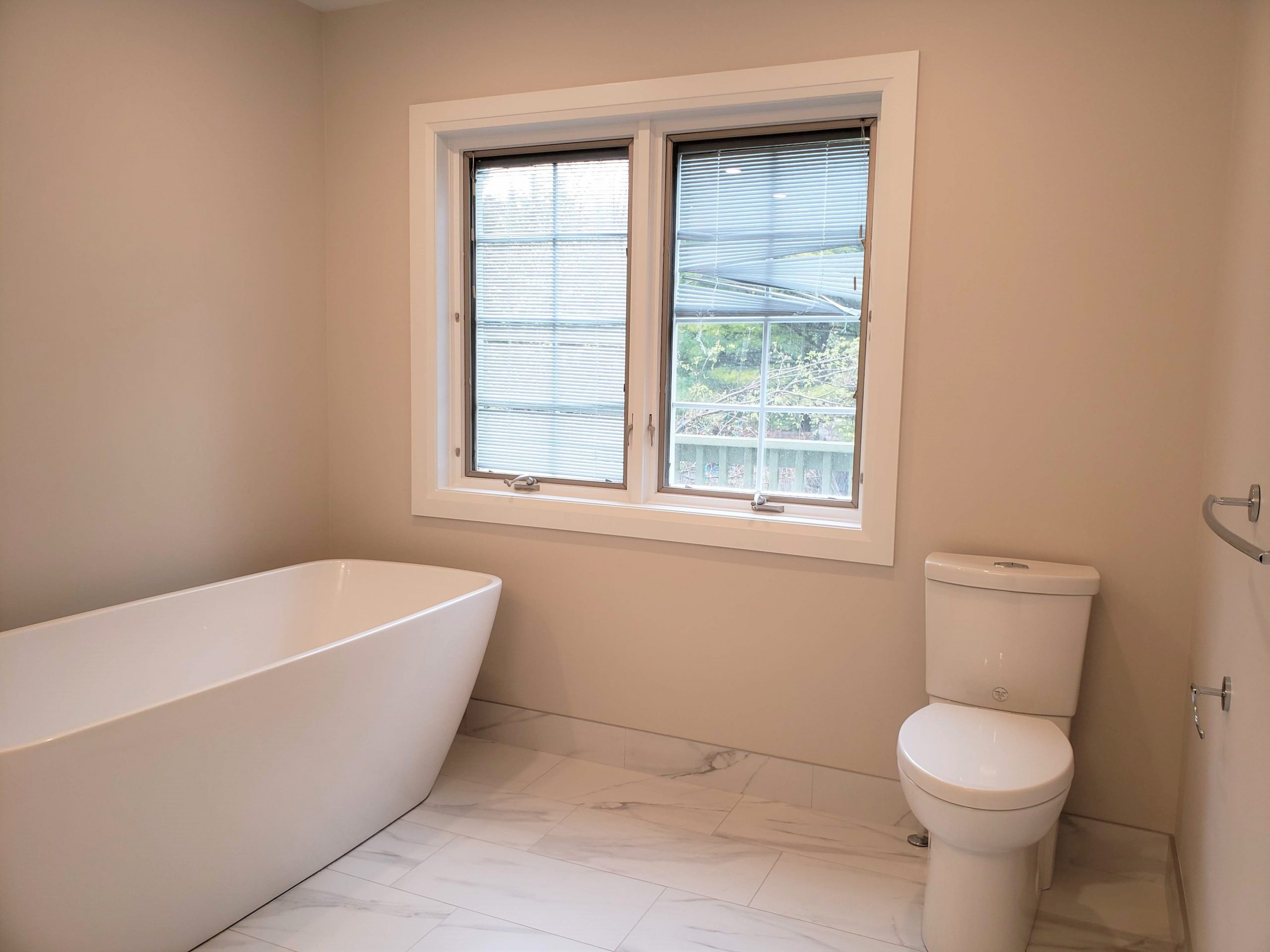 Porcelain tile flooring installed and a new toilet