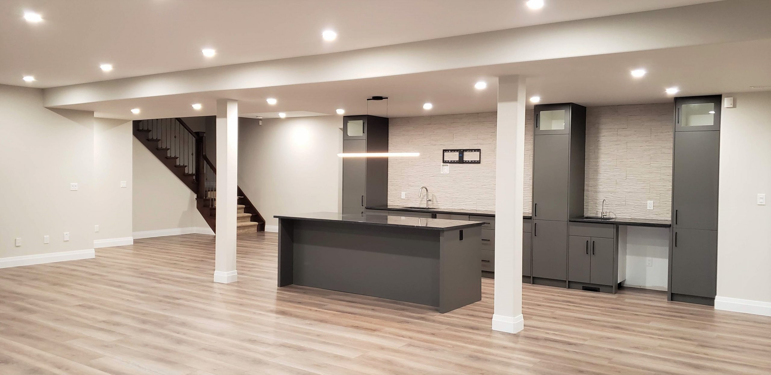 Basement bar featuring granite countertops