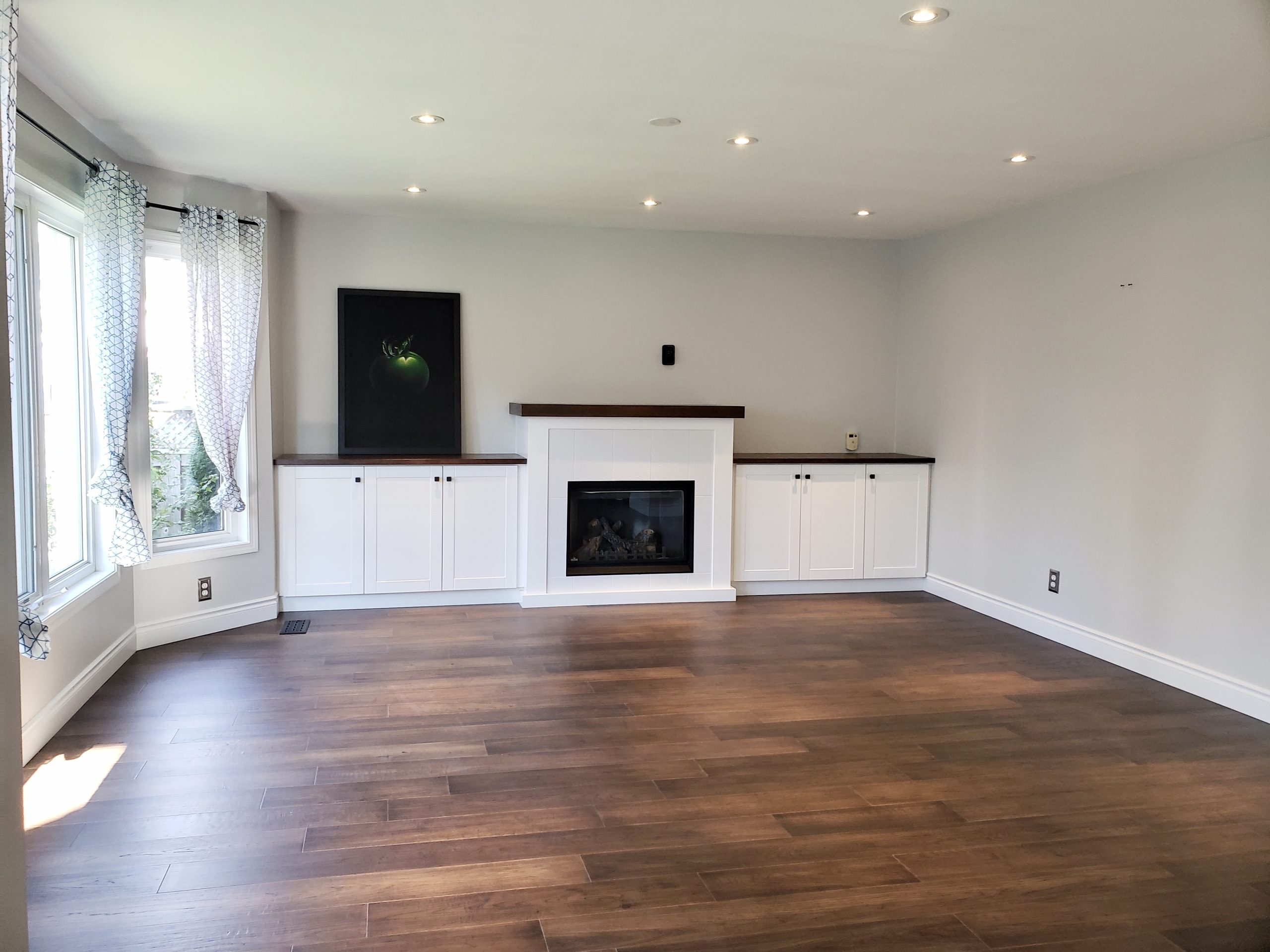 Fireplace unit featuring wood veneer mantle