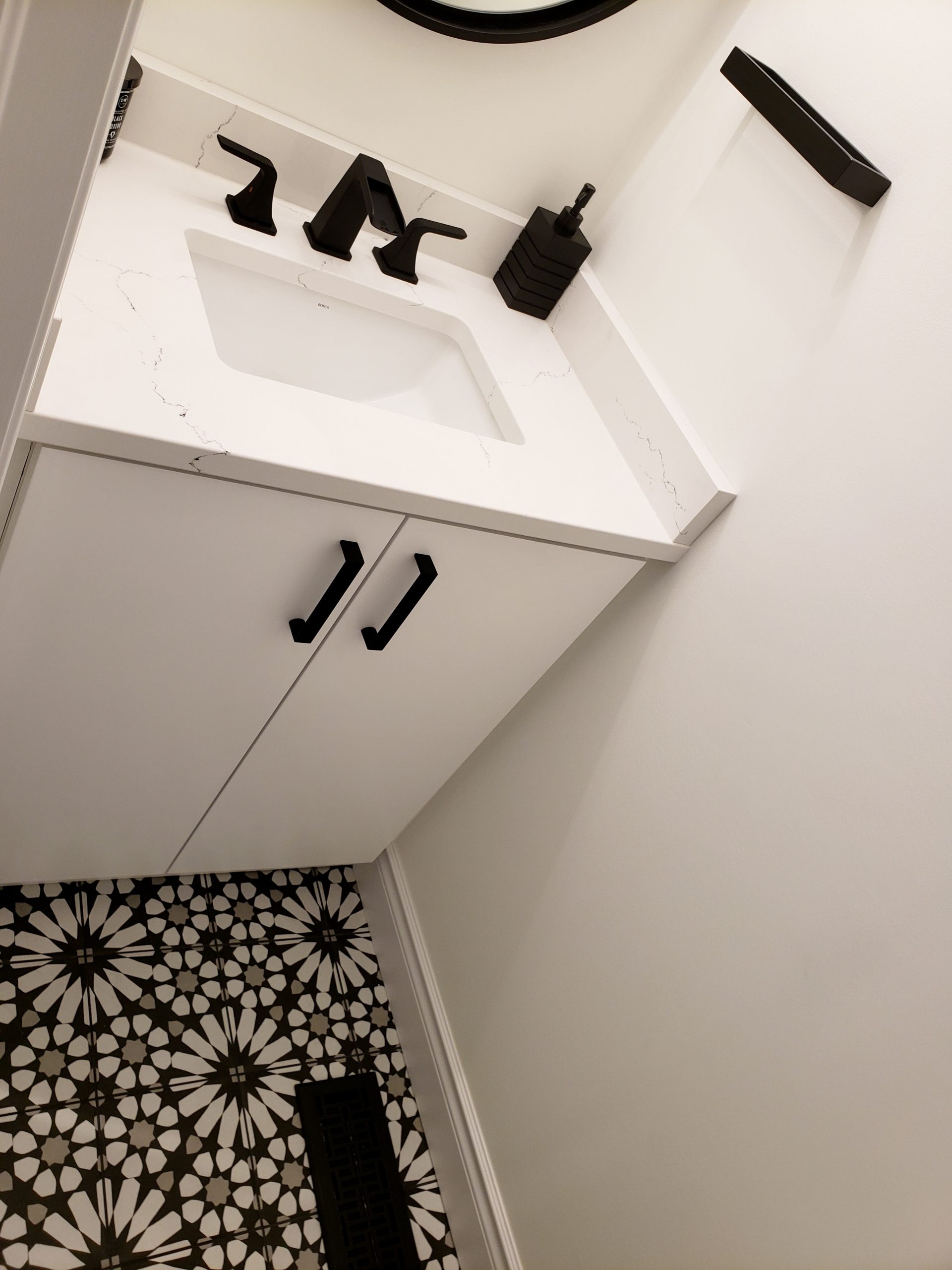 Powder room renovation featuring white quartz countertop