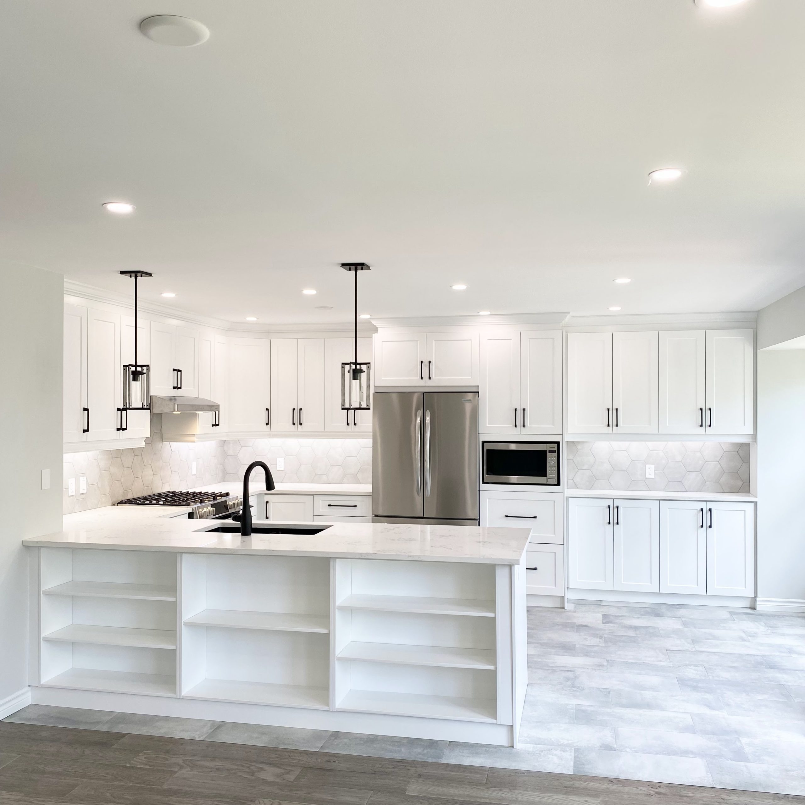 New kitchen featuring hexagonal backsplash
