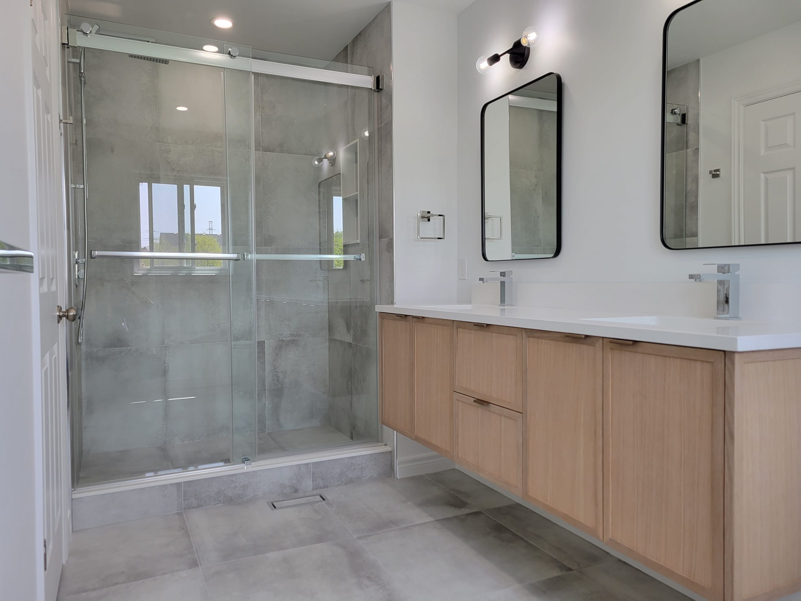 Ensuite washroom featuring wall mounted vanity